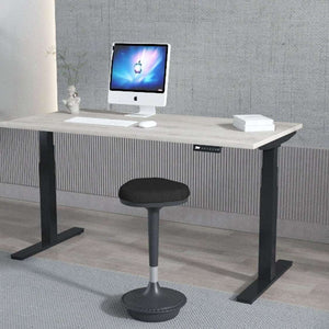 This is the grey oak desk top with black legs in use in someones home office.