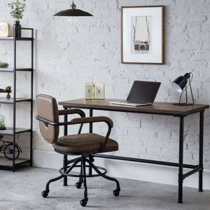 Picture showing how the carnegie pipe mocha elm home office desk would look like in your home office. with lamp , laptop and photo on the desk.