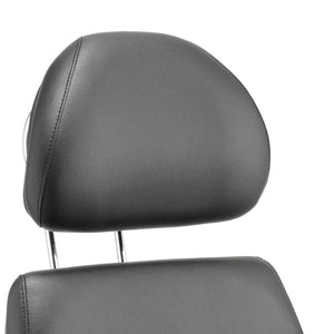 Close up of the black leather contoured foam padded headrest 