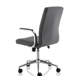 Showing side view of the grey ezra chair with contoured backrest , padded chrome boomerang style armrests  with chrome 5 star base with black castor wheels.