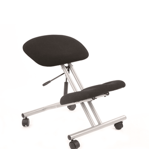 Showing the knmeeling stool in silver robust frame with black fabric cushioned pads with castor wheels for easy moving around the home office.