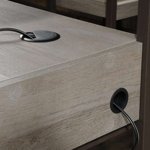 manhattan view l shaped mystic oak finish home office desk. close up of the grommet hole that will aid you with a cord managment to keep everything nice and tidy.