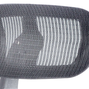 Meshed contoured headrest of the mirage ii in black.