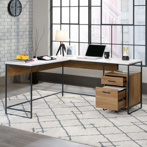 moderna l shaped in sindoori mango with white accents home office desk. close of the desk with laptop items being used.