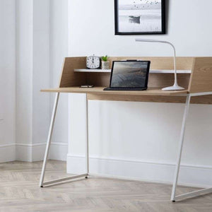 Picture of the palmer home office desk with laptop  lamp and office items on the desk to show you what it would look like in your home office being used.