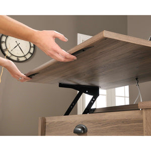 sit-stand home office desk in salt oak, showing being lifted so you can stand instead of sitting at your desk.