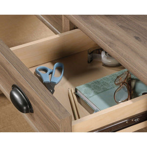 sit-stand home office desk in salt oak. close up of drawer that have your office equipment like pens, pencils etc.