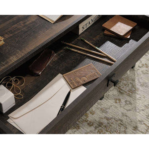 steel gorge home office desk with carbon oak effect finish, close up of the  storage drawer for your office items.