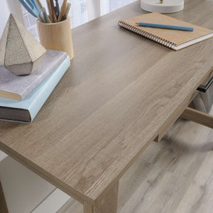 summer oak effect trestle home office desk with stationery drawer. close up of oak effect trestle in the home.